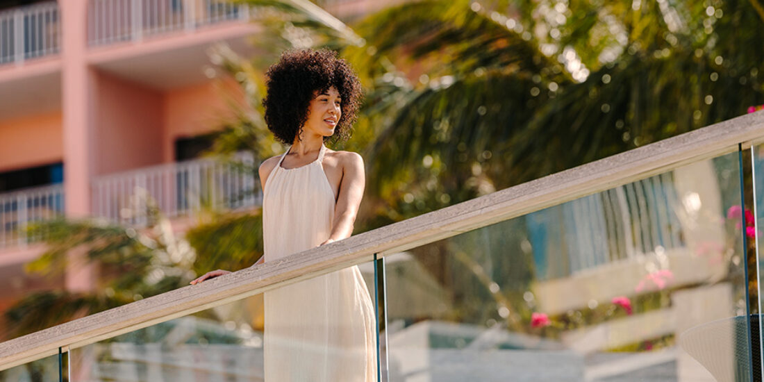 Woman enjoying the view of the Marina at the Hamilton Princess Bermuda