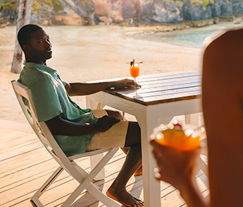 Enjoying drinks on the beach at the hamilton princess beach club in bermuda