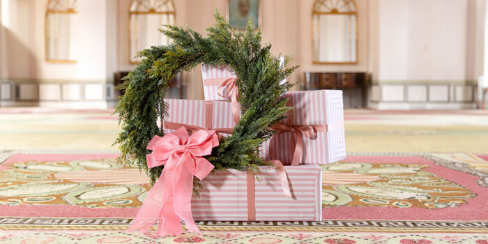 Hamilton Princess Christmas Offers - presents and a christmas wreath in the princess ballroom
