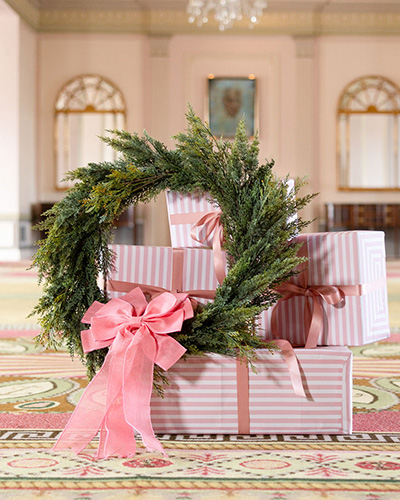 Hamilton Princess Christmas Offers - presents and a christmas wreath in the princess ballroom